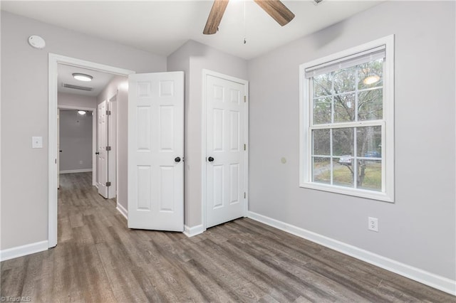 unfurnished bedroom with hardwood / wood-style flooring and ceiling fan