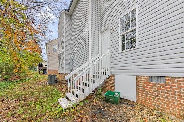 view of side of home featuring central air condition unit