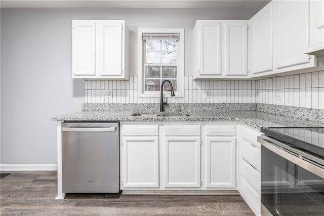 kitchen with dark hardwood / wood-style flooring, sink, white cabinets, and appliances with stainless steel finishes