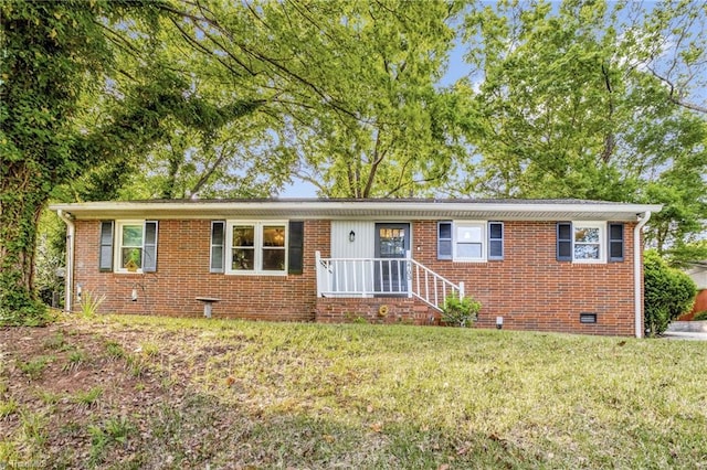 2703 W Cornwallis Dr, Greensboro, NC 27408 - single story home featuring brick siding, a front lawn, and crawl space