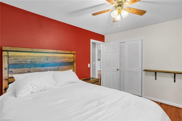 2703 W Cornwallis Dr, Greensboro, NC 27408 - bedroom featuring a closet, wood finished floors, baseboards, and ceiling fan