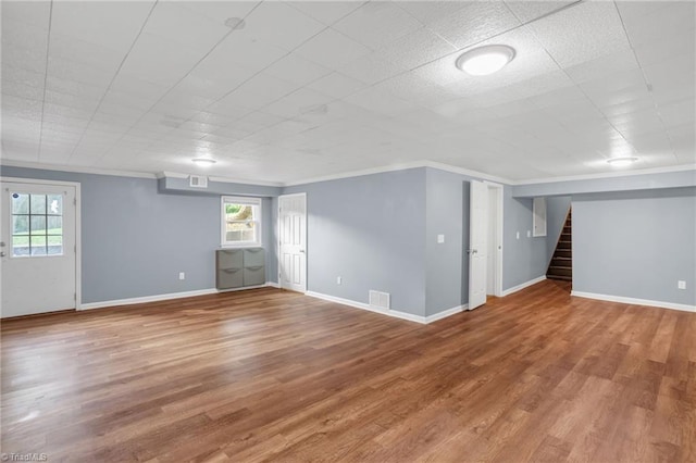 2703 W Cornwallis Dr, Greensboro, NC 27408 - below grade area featuring crown molding, visible vents, a healthy amount of sunlight, and stairs