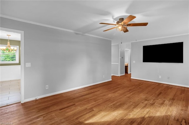 2703 W Cornwallis Dr, Greensboro, NC 27408 - unfurnished living room with baseboards, wood finished floors, ceiling fan with notable chandelier, and ornamental molding