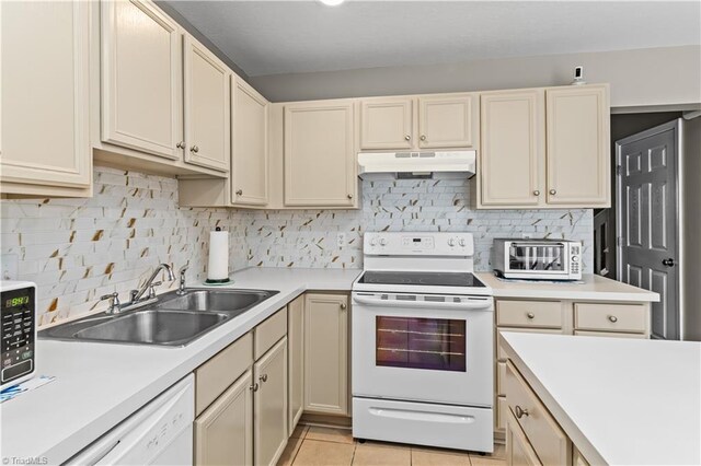 2525 Halle Ann Cir, Winston-Salem, NC 27103 - kitchen featuring under cabinet range hood, white appliances, a sink, and light countertops