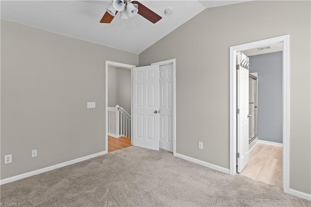 2525 Halle Ann Cir, Winston-Salem, NC 27103 - unfurnished bedroom featuring carpet floors, vaulted ceiling, baseboards, and ceiling fan