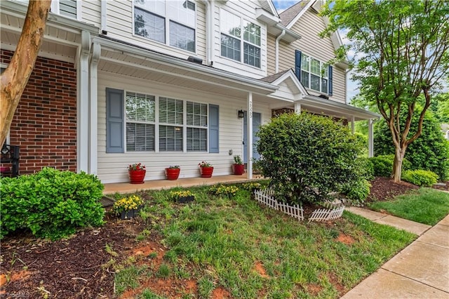 2525 Halle Ann Cir, Winston-Salem, NC 27103 - doorway to property featuring a porch and brick siding