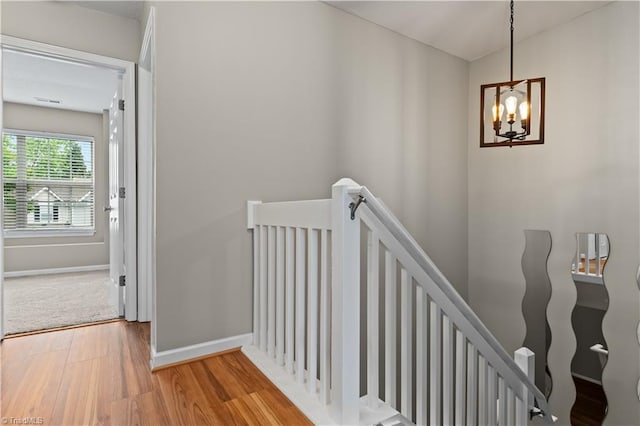 2525 Halle Ann Cir, Winston-Salem, NC 27103 - stairs with wood finished floors, a chandelier, and baseboards