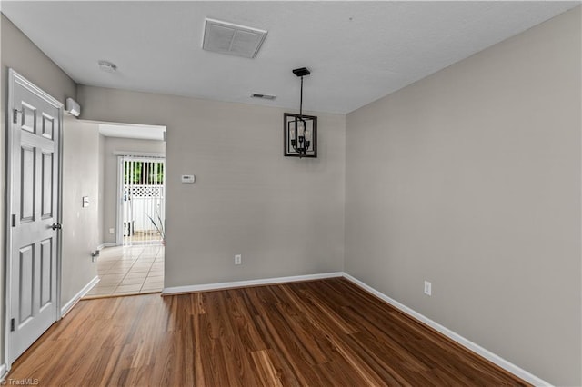 2525 Halle Ann Cir, Winston-Salem, NC 27103 - unfurnished dining area featuring baseboards, wood finished floors, and a chandelier