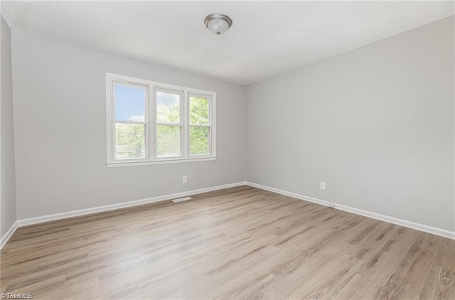 2725 New Walkertown Rd, Winston-Salem, NC 27105 - unfurnished room featuring baseboards and light wood finished floors