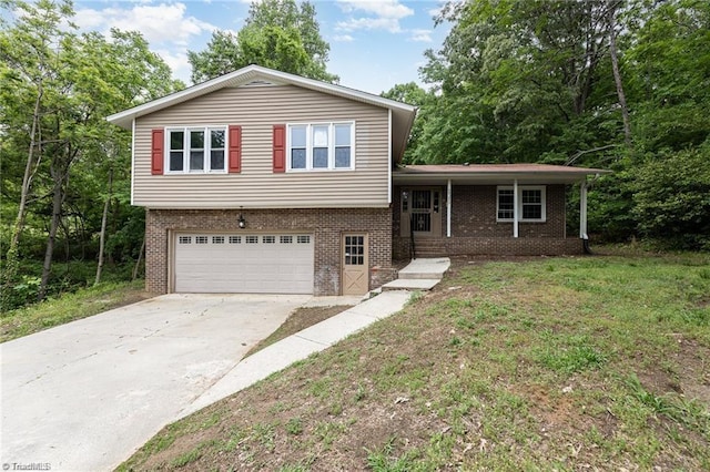 2725 New Walkertown Rd, Winston-Salem, NC 27105 - split level home with brick siding, a garage, concrete driveway, covered porch, and a front lawn