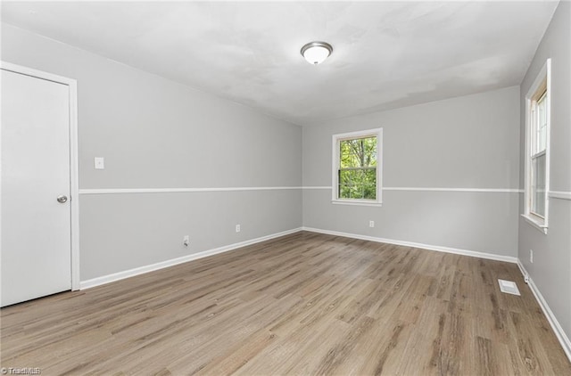2725 New Walkertown Rd, Winston-Salem, NC 27105 - empty room with wood finished floors and baseboards