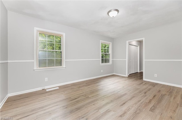 spare room featuring light hardwood / wood-style floors