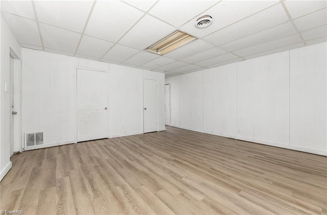 2725 New Walkertown Rd, Winston-Salem, NC 27105 - basement featuring wood finished floors and a drop ceiling