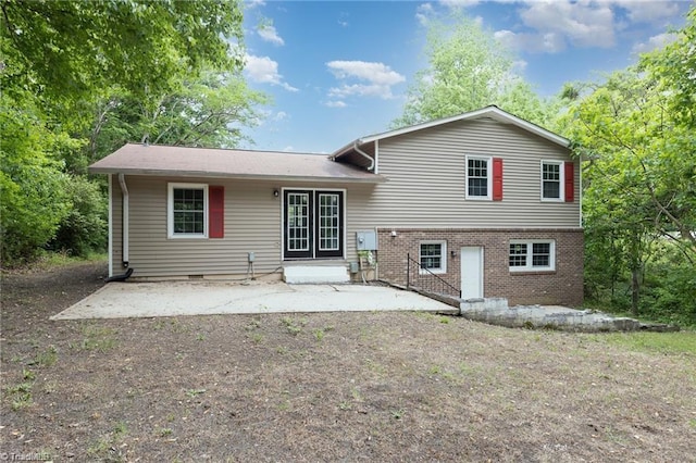 back of property with a patio