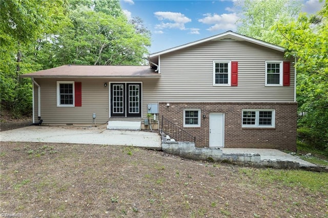 back of house with a patio area