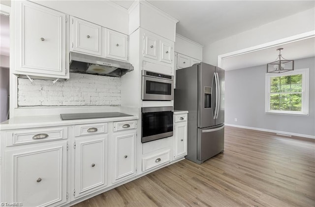 2725 New Walkertown Rd, Winston-Salem, NC 27105 - kitchen with stainless steel appliances, under cabinet range hood, light countertops, light wood-style flooring, and tasteful backsplash