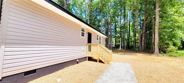 view of property exterior featuring crawl space