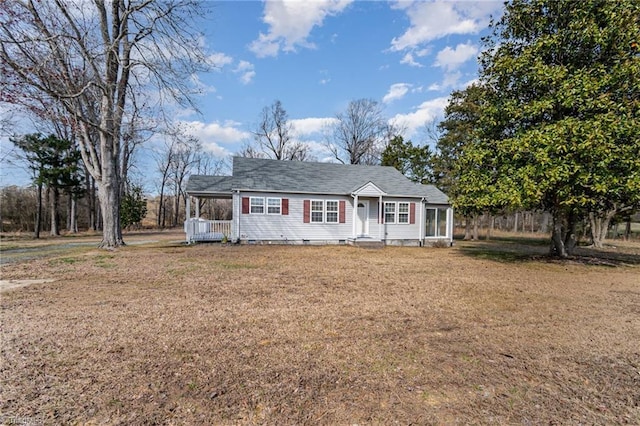 single story home with crawl space, a front lawn, and an attached carport