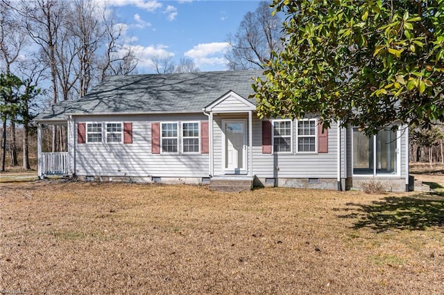 view of front of house with a shingled roof, crawl space, and a front lawn