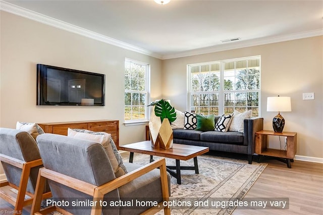 living room with crown molding, baseboards, visible vents, and wood finished floors