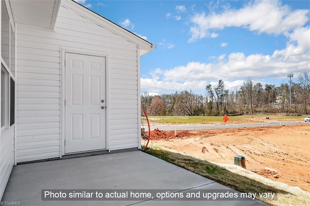 property entrance with a patio