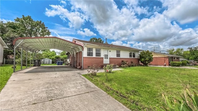 2914 Phillips Ave, Greensboro, NC 27405 - ranch-style home featuring brick siding, a storage shed, a front lawn, driveway, and a carport
