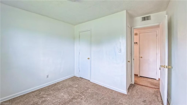 2914 Phillips Ave, Greensboro, NC 27405 - unfurnished bedroom with carpet and a closet