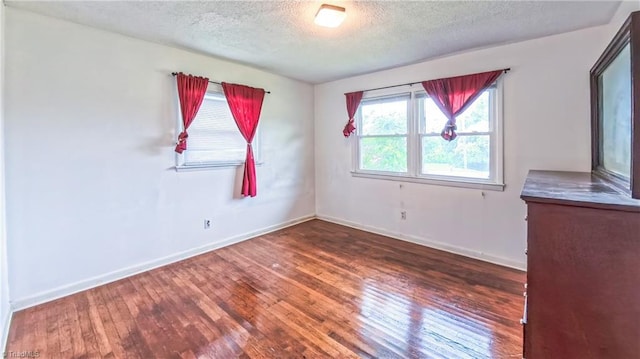 2914 Phillips Ave, Greensboro, NC 27405 - unfurnished room with a textured ceiling and wood-type flooring