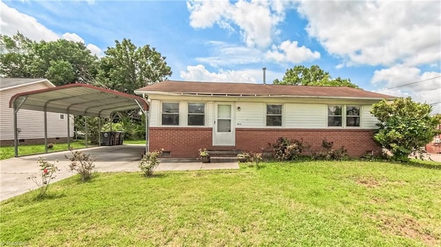 2914 Phillips Ave, Greensboro, NC 27405 - view of front facade featuring brick siding, a front lawn, driveway, a detached carport, and entry steps