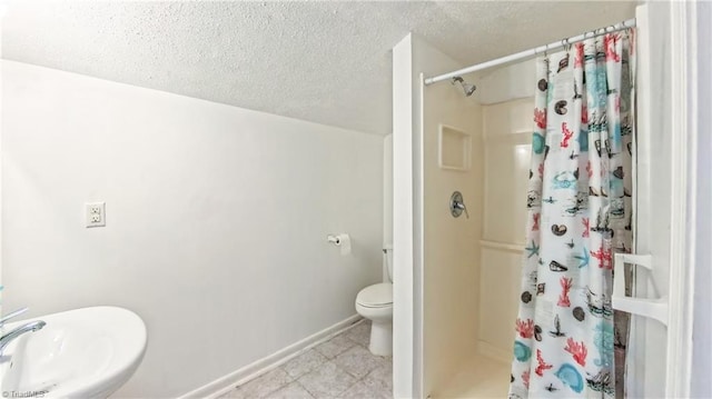2914 Phillips Ave, Greensboro, NC 27405 - full bathroom featuring a textured ceiling and a stall shower