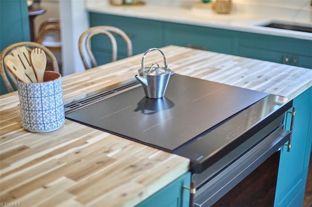 523 N Main St, Graham, NC 27253 - room details featuring blue cabinets and wood counters
