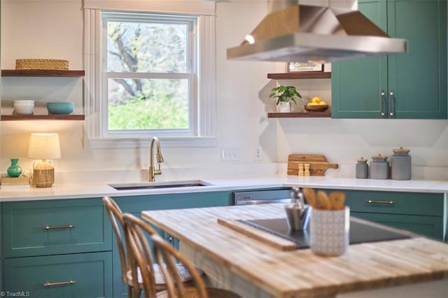523 N Main St, Graham, NC 27253 - kitchen featuring stainless steel dishwasher, open shelves, light countertops, a sink, and wall chimney exhaust hood