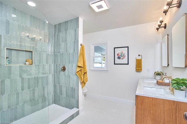 523 N Main St, Graham, NC 27253 - full bathroom featuring tile patterned floors, a walk in shower, toilet, vanity, and baseboards