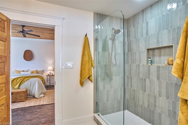 523 N Main St, Graham, NC 27253 - ensuite bathroom with a walk in shower, a ceiling fan, baseboards, wood finished floors, and ensuite bathroom
