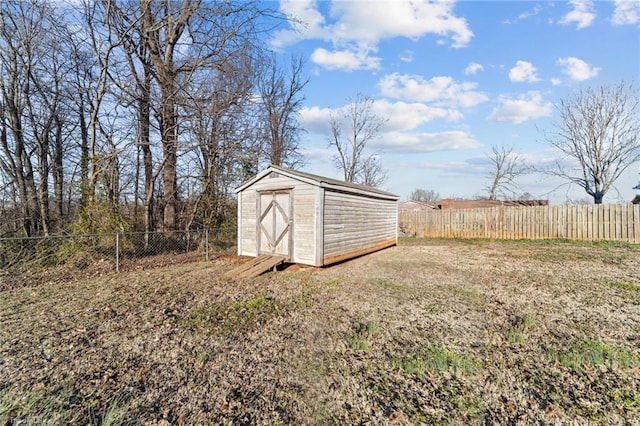 view of shed with a fenced backyard