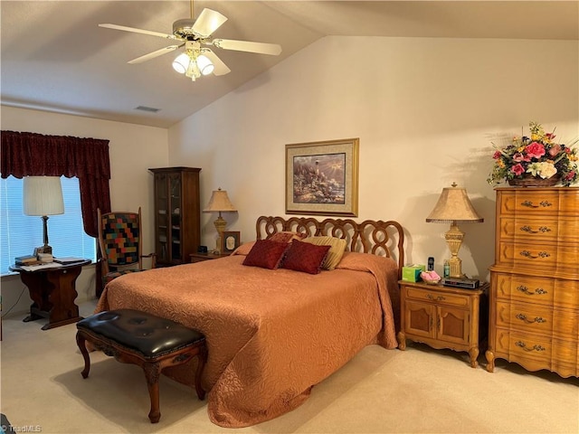 carpeted bedroom featuring vaulted ceiling and ceiling fan