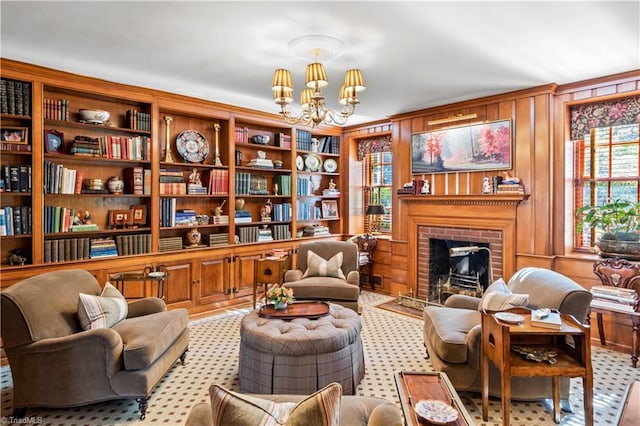 living area featuring a chandelier, healthy amount of natural light, a brick fireplace, and wooden walls