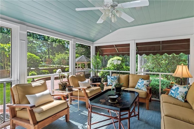 sunroom / solarium with outdoor lounge area, a ceiling fan, and vaulted ceiling