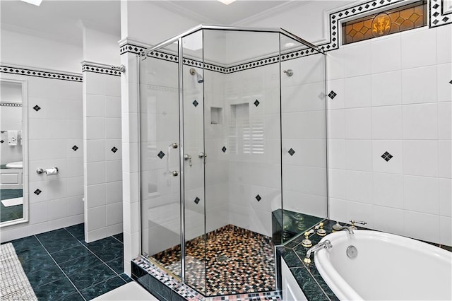 full bathroom featuring tile walls, ornamental molding, a stall shower, and a bath