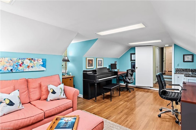 office space featuring wood finished floors and lofted ceiling