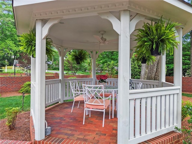 view of patio / terrace with ceiling fan, a gazebo, and outdoor dining area