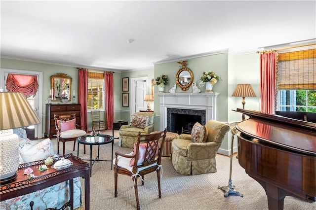 living area featuring ornamental molding, carpet, and a fireplace