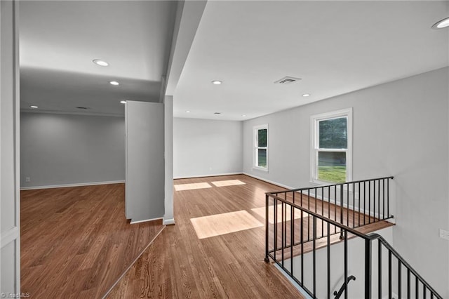 interior space featuring recessed lighting, visible vents, and wood finished floors