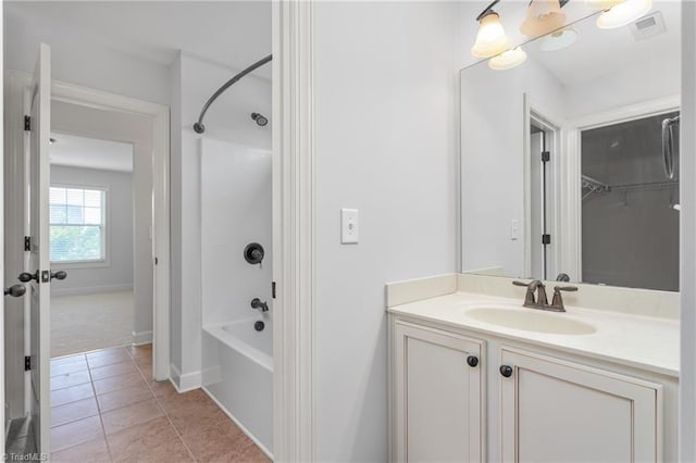 2403 Hammock Dr, High Point, NC 27265 - bathroom with washtub / shower combination, vanity, tile patterned flooring, a chandelier, and a spacious closet
