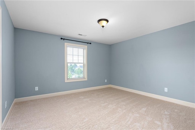 2403 Hammock Dr, High Point, NC 27265 - spare room featuring light colored carpet and baseboards