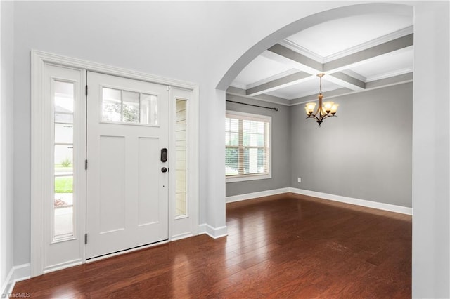 2403 Hammock Dr, High Point, NC 27265 - foyer entrance featuring dark wood-style flooring, arched walkways, a chandelier, beamed ceiling, and coffered ceiling
