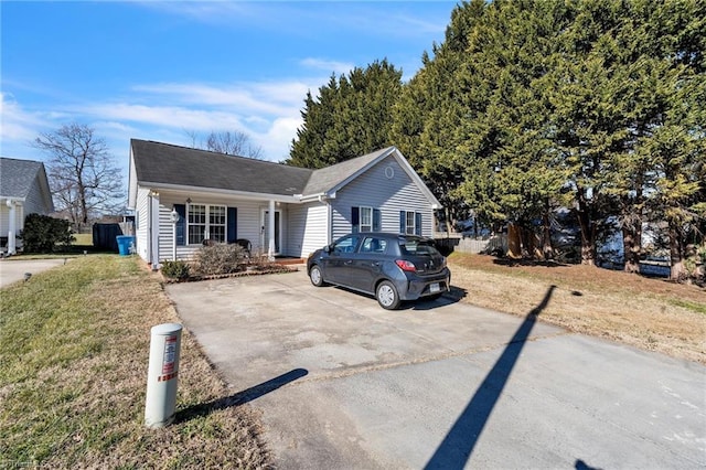 ranch-style home with a front lawn