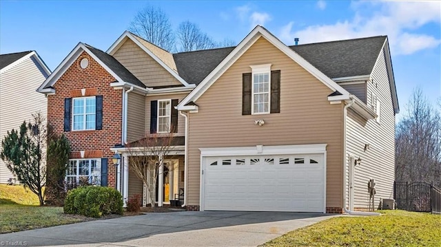 front facade featuring a front yard and a garage