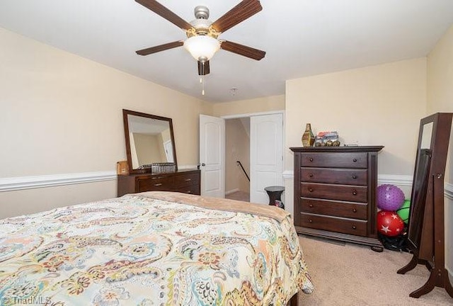 bedroom featuring ceiling fan and light colored carpet