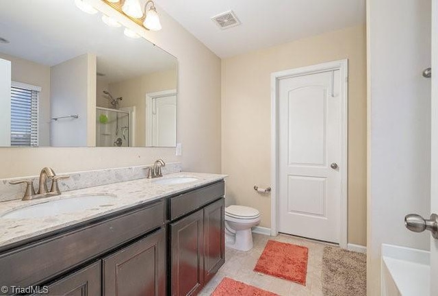 bathroom with vanity, toilet, and walk in shower